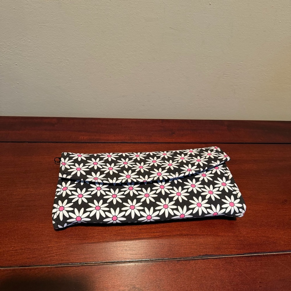 Mainstreet Collection black/white daisy pattern trifold jewelry travel pouch.